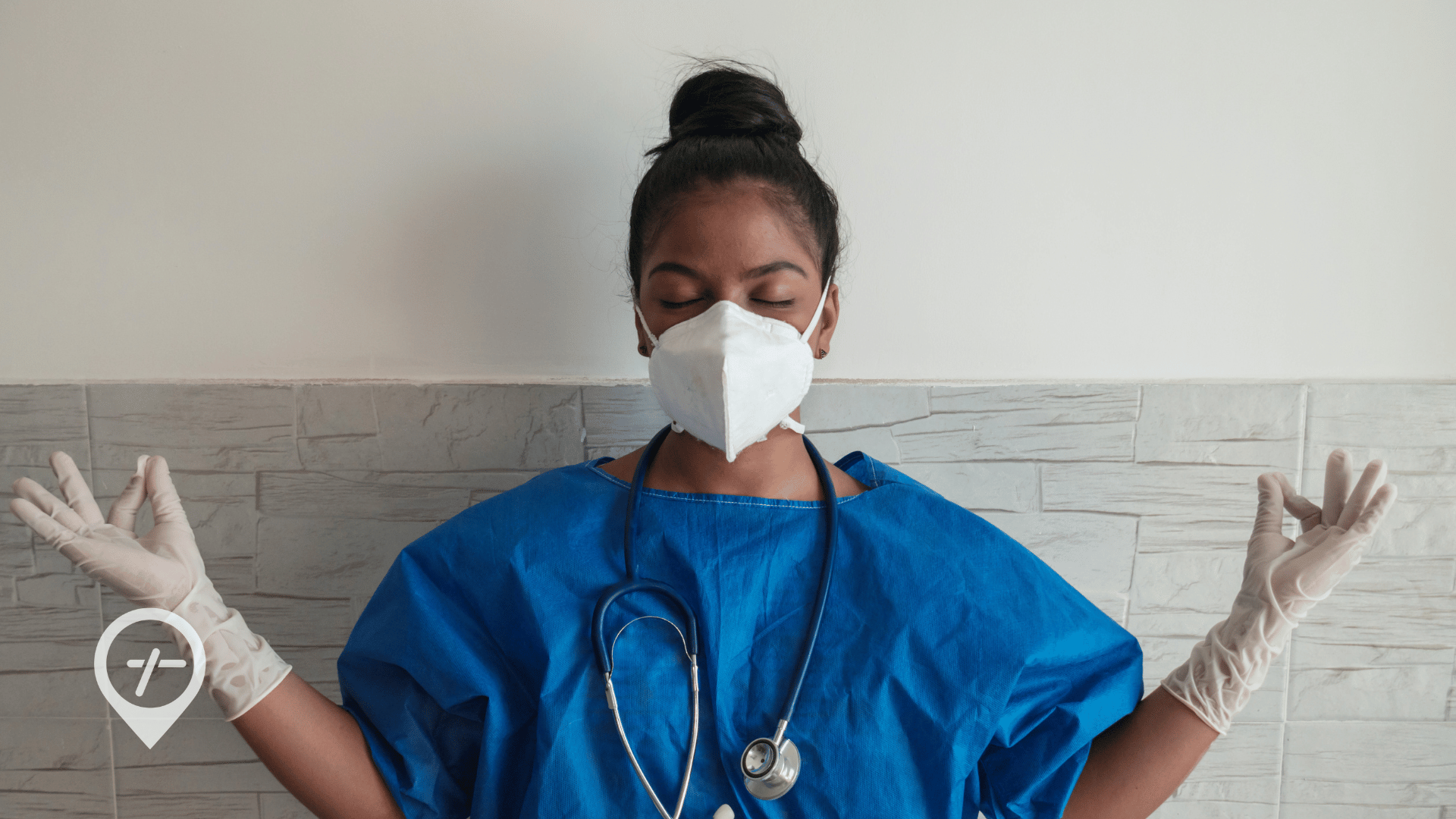 An image of a nurse practicing meditation at work to help with stress management.