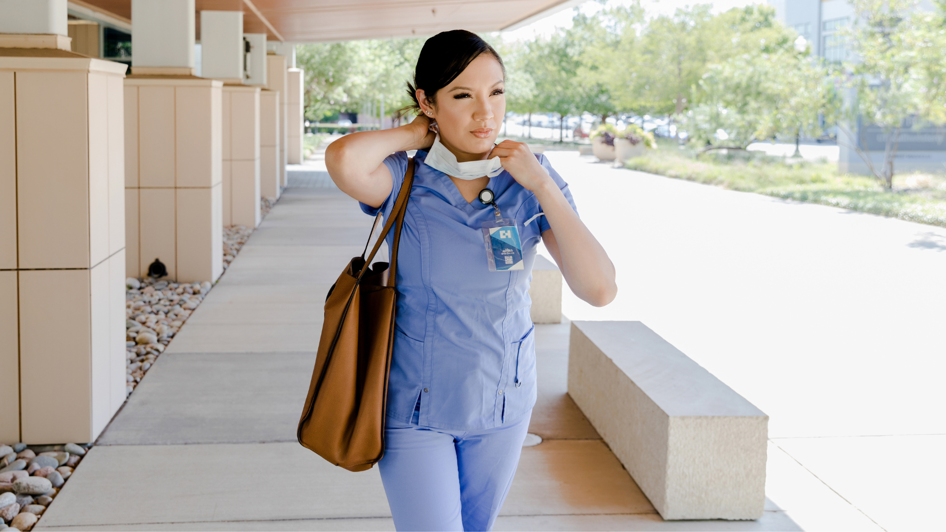 Nurse heading to work and showing signs of emotional labor.