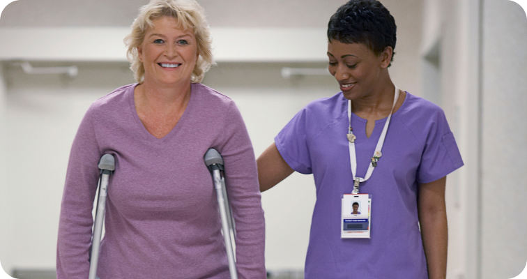 Green Meadows Case Study image - nurse walking with a patient