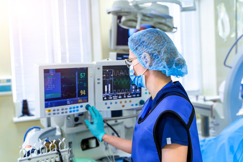 Nurse case manager checking monitoring equipment