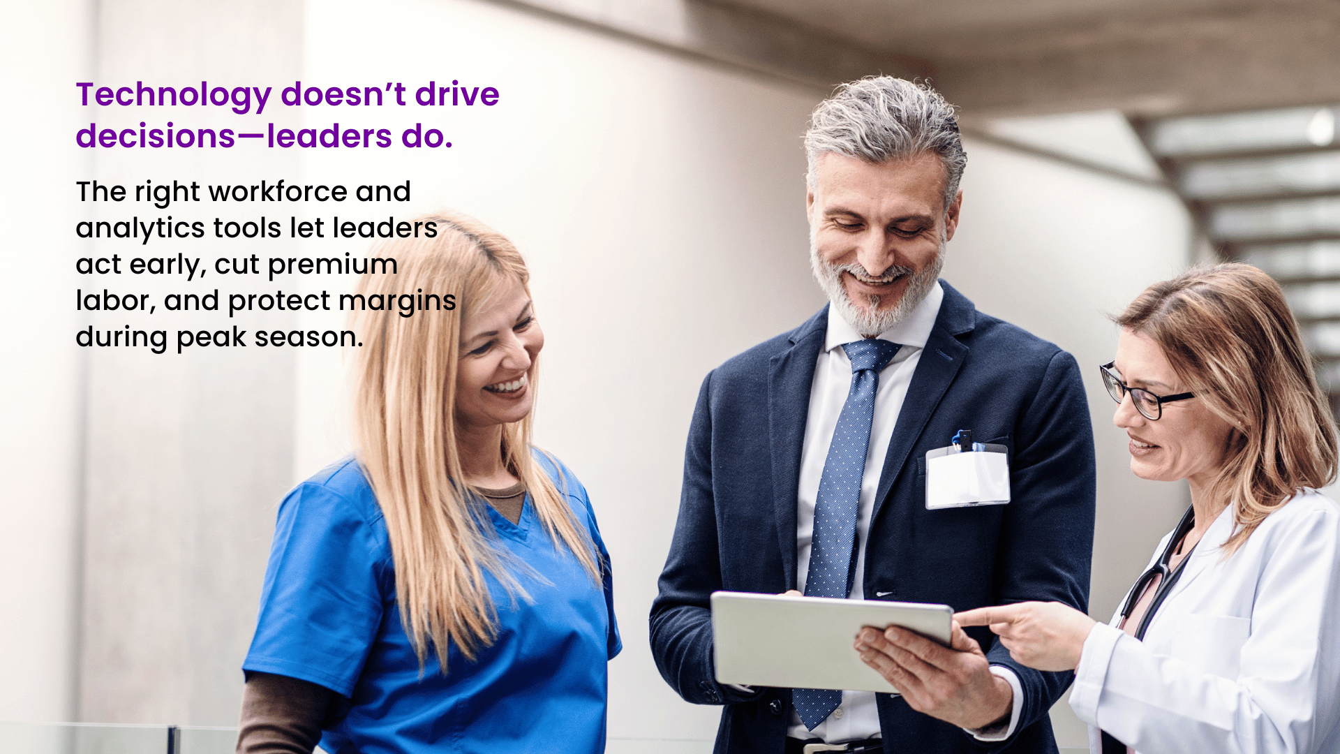 Hospital COO reviewing workforce analytics with clinical team members.