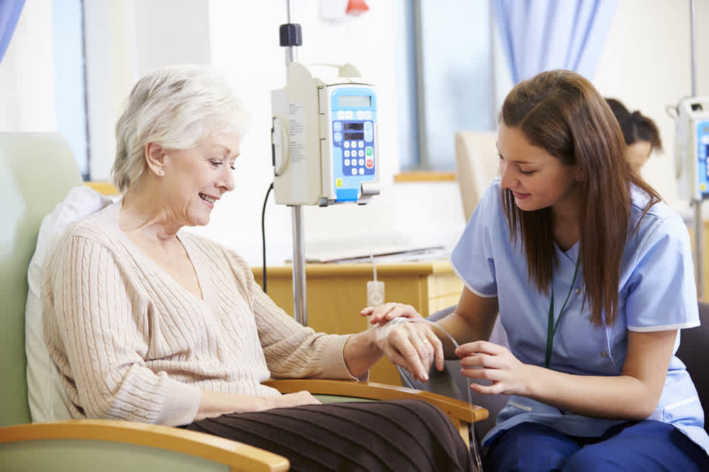 Oncology-certified nurse treating a patient