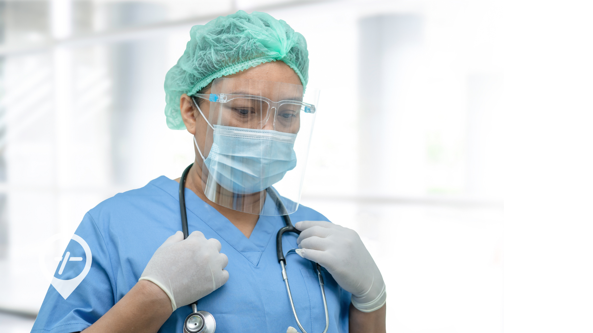 A nurse walks through the hospital, looking down as if facing an ethical dilemma.