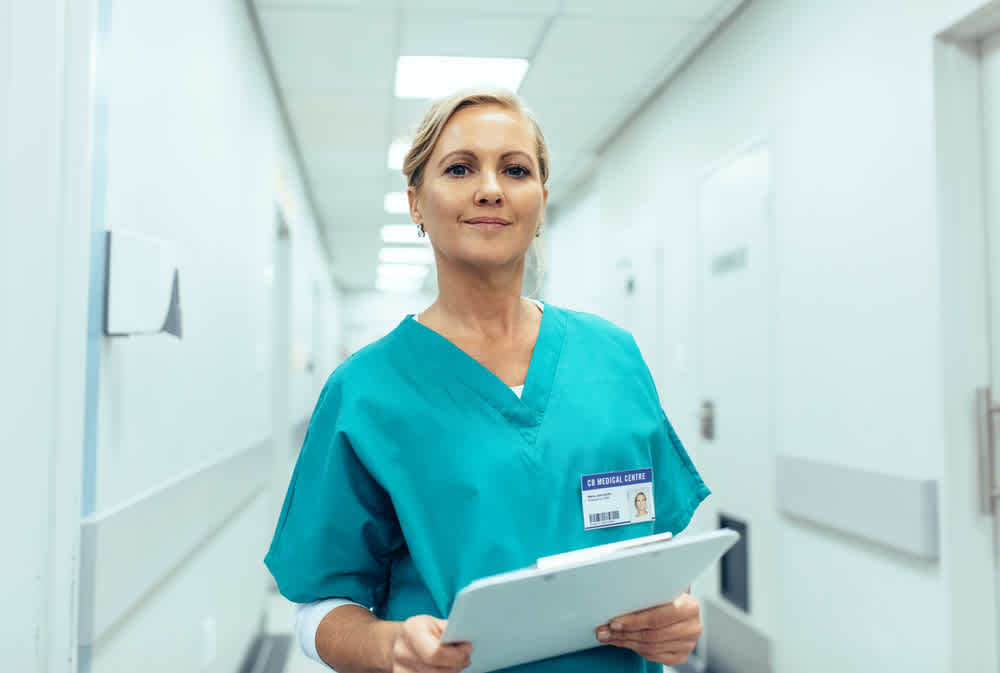 PRN nurse walking through a hospital corridor