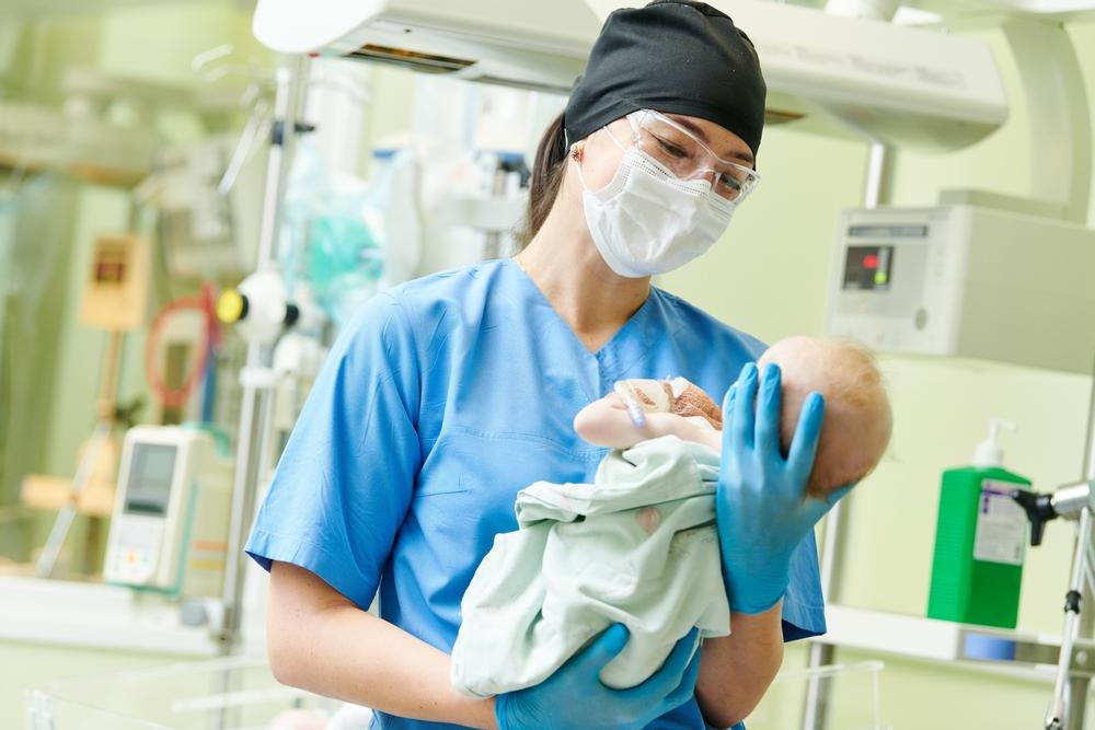 Neonatal Nurse Practitioner with baby