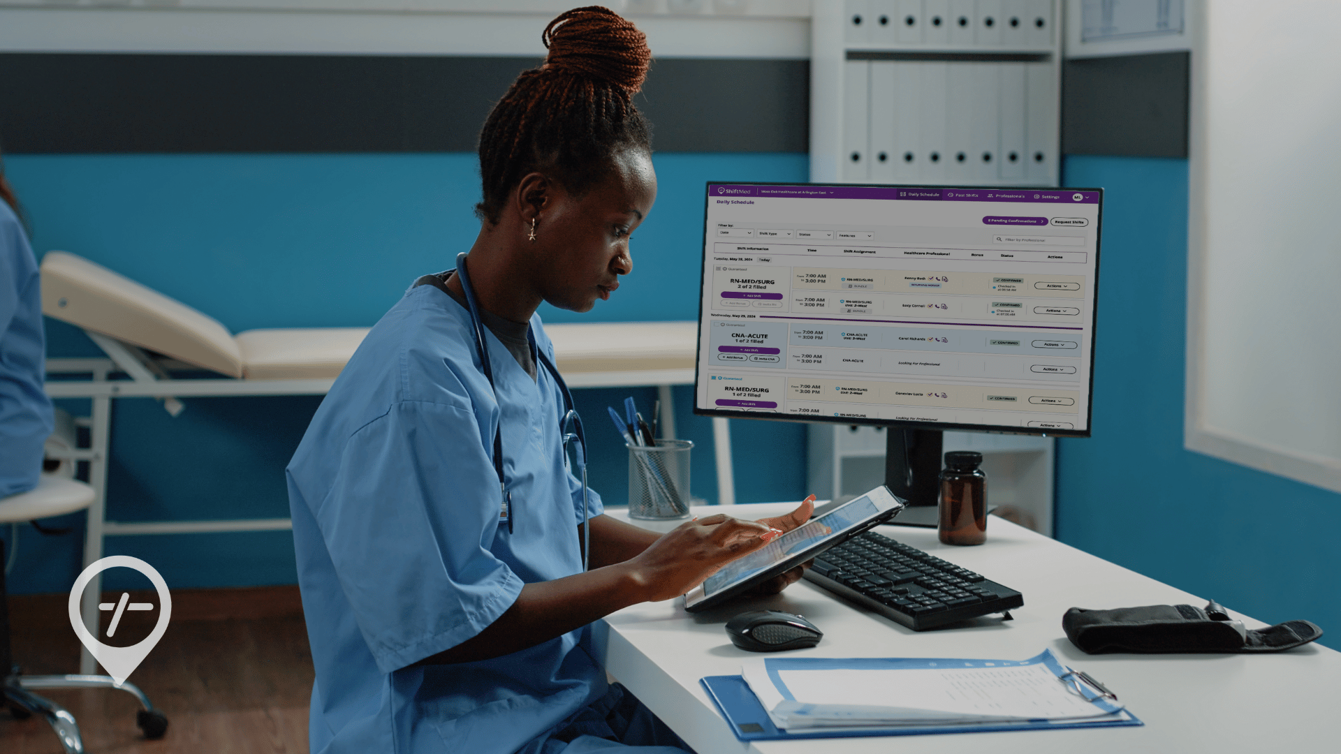 A hospital nurse sits at a desk using open shift management to fill scheduling gaps.