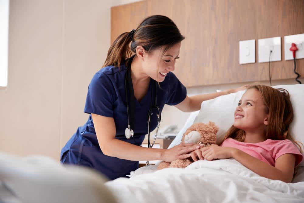 Pediatric Nurse with a child in the hospital 