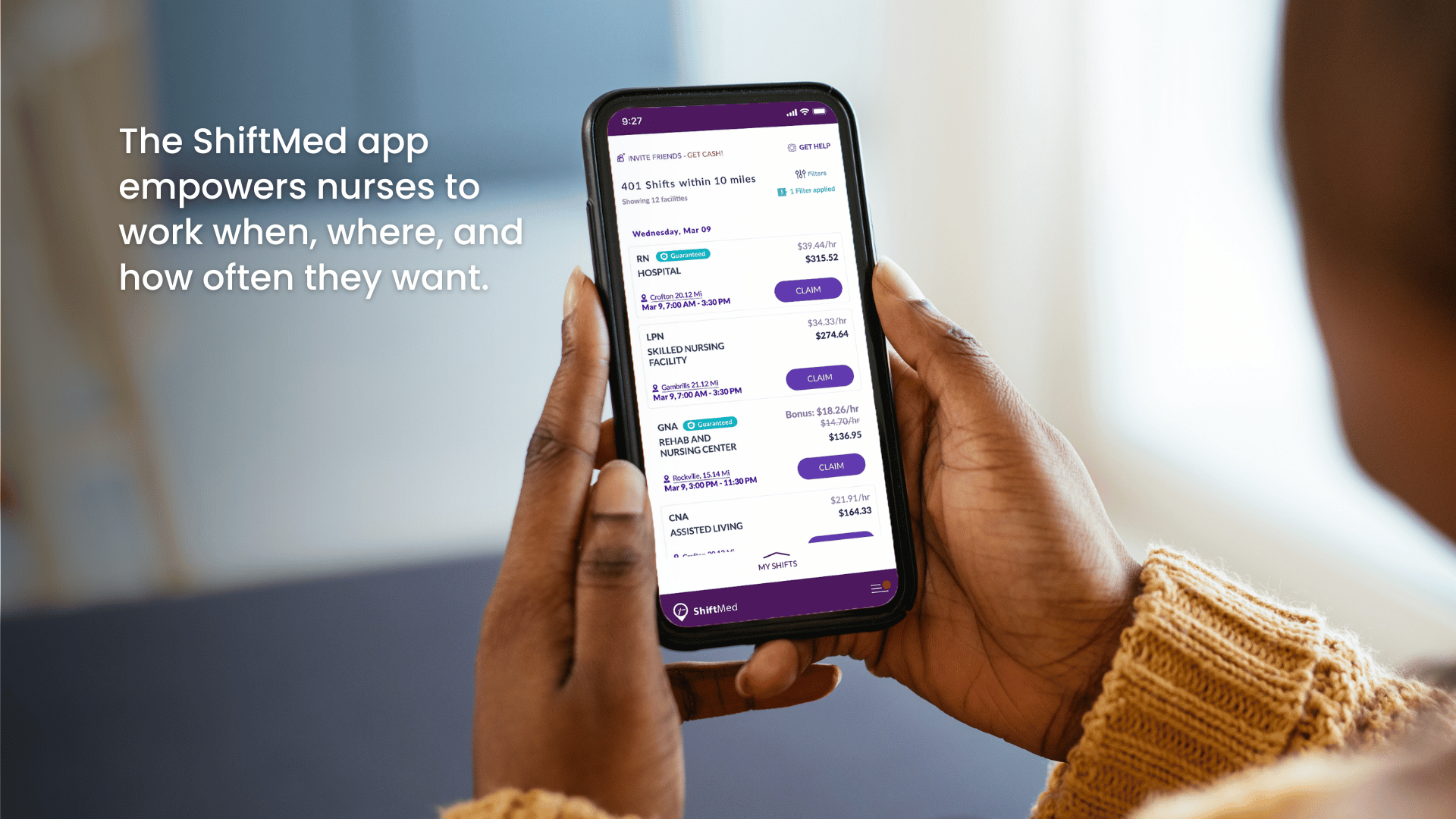 A nurse looks at the ShiftMed nursing jobs app on her phone to find flexible shifts in her community. 