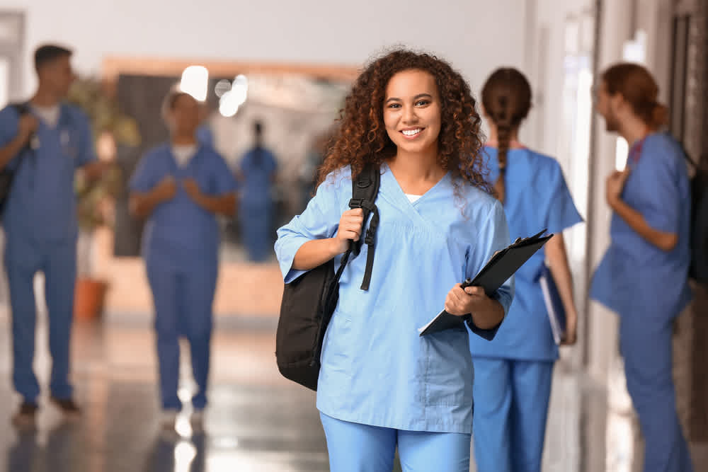 Nurse educator walking through a hospital