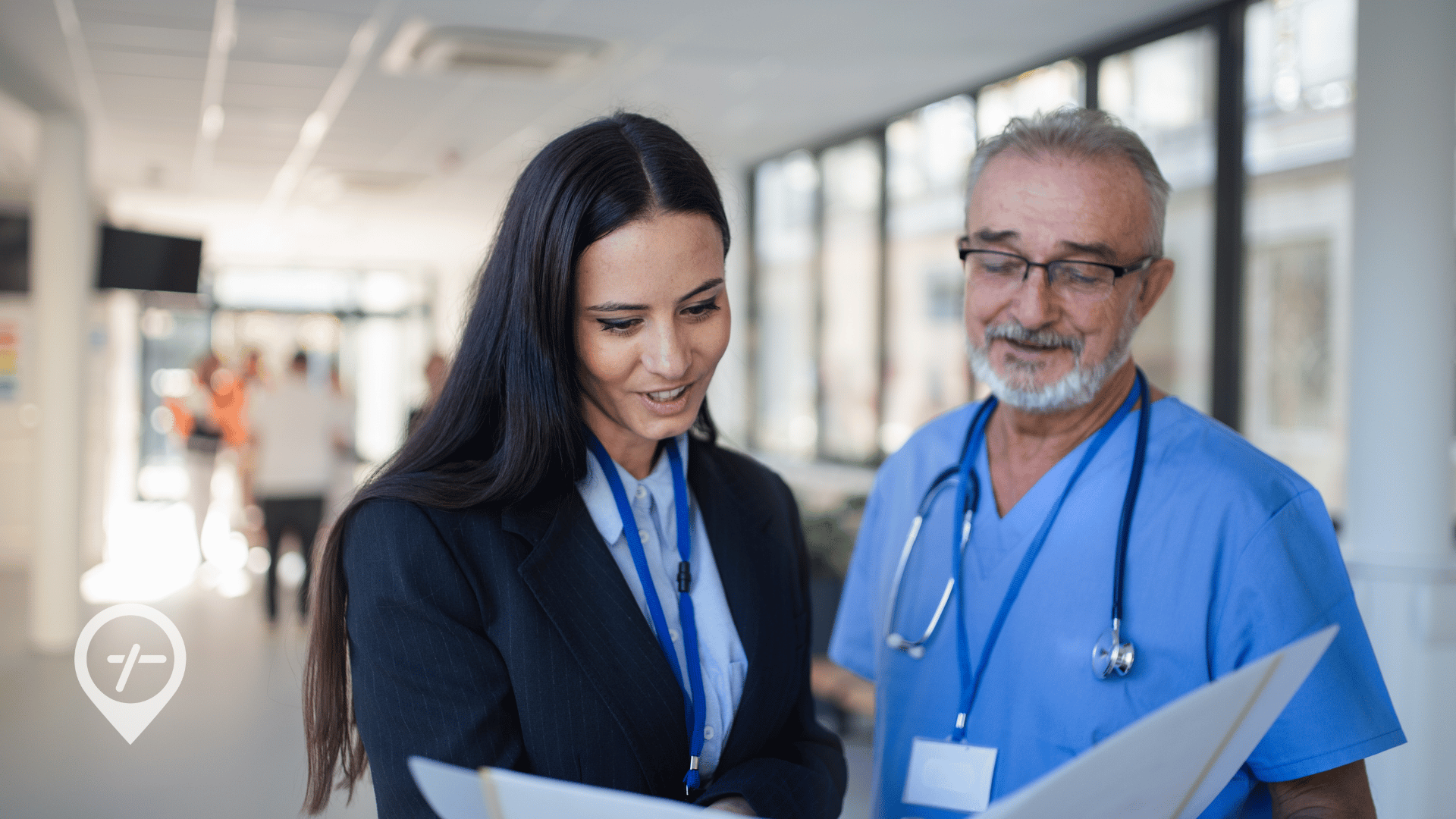 A hospital CNO shows care model information to a nurse.