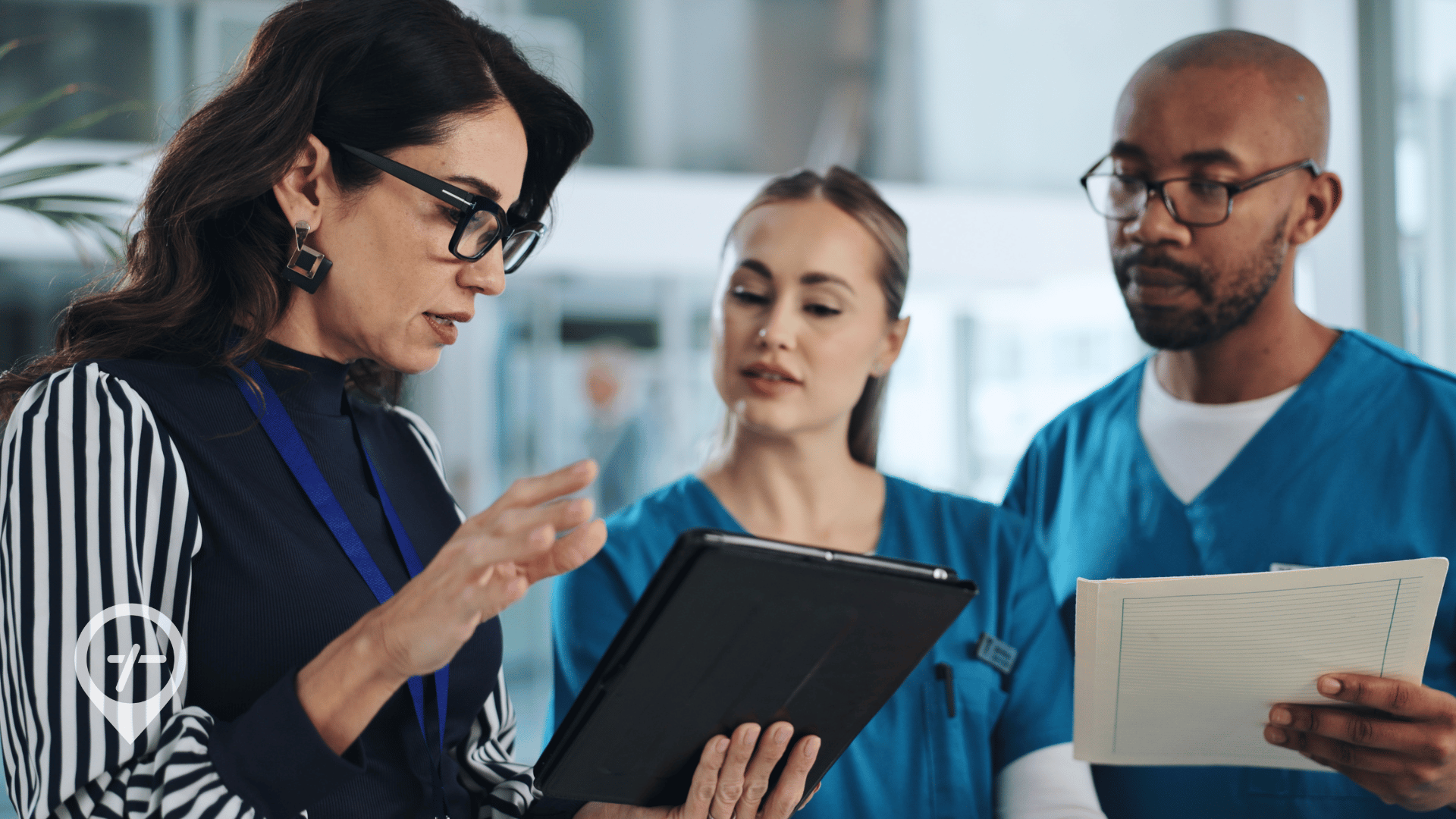 A nurse leader talks to two members of her nursing staff about strategic planning.