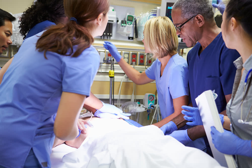 Emergency room nurse with colleagues