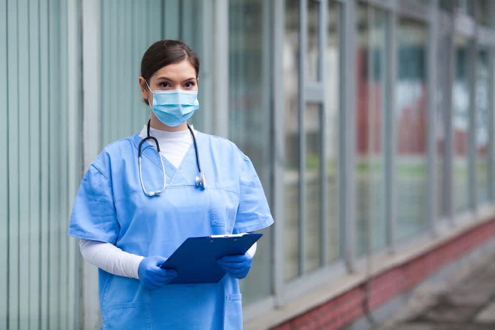 Triage nurse standing outside
