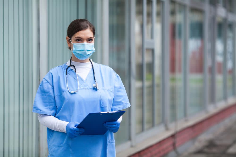 Triage nurse standing outside