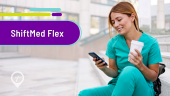 A nurse sits on the steps outside of work, looking at the available shifts on the ShiftMed Flex nursing jobs app.