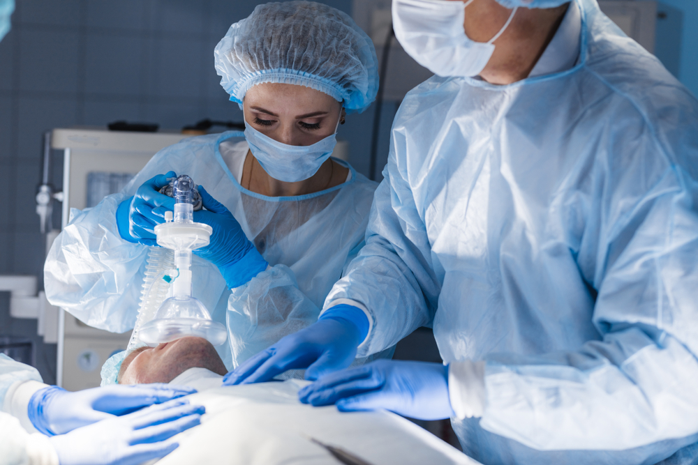 A CRNA working in a surgical theatre