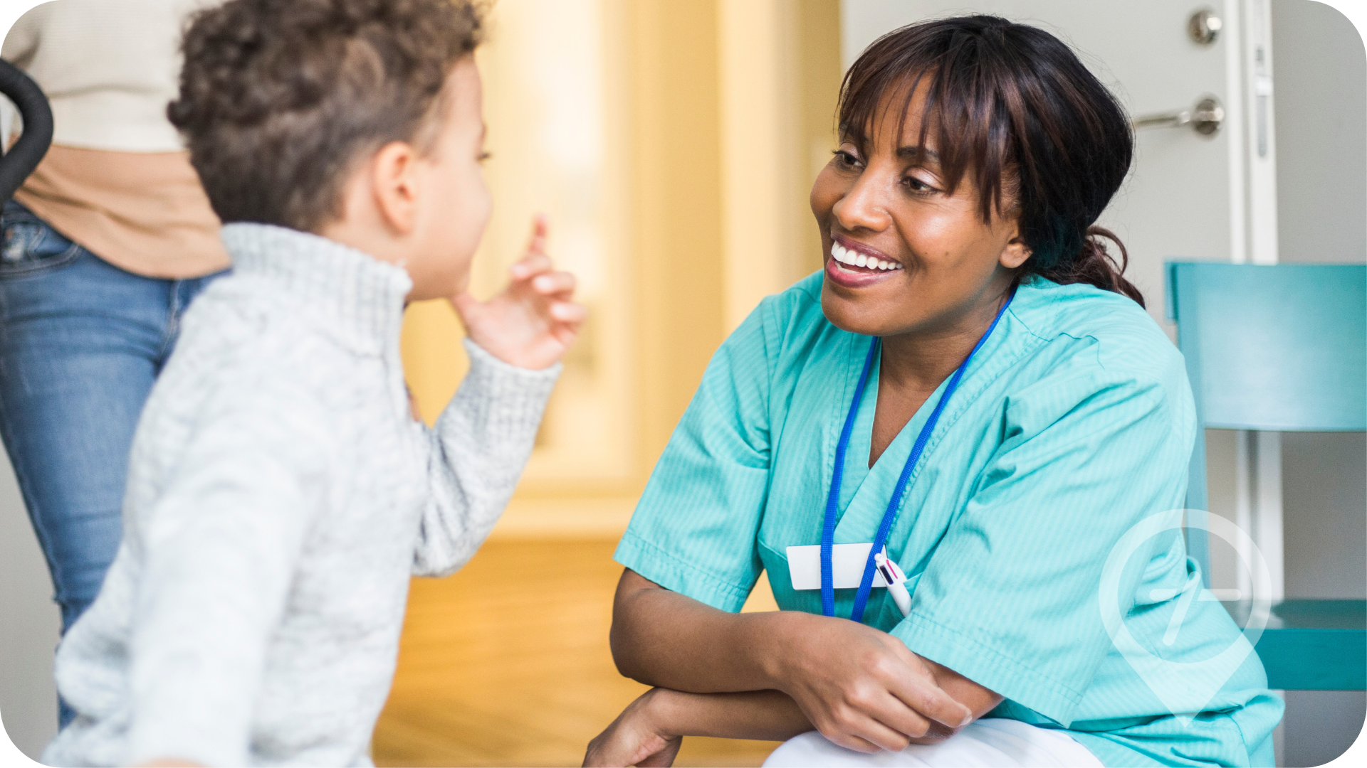 African American female nurse cares for young patient.