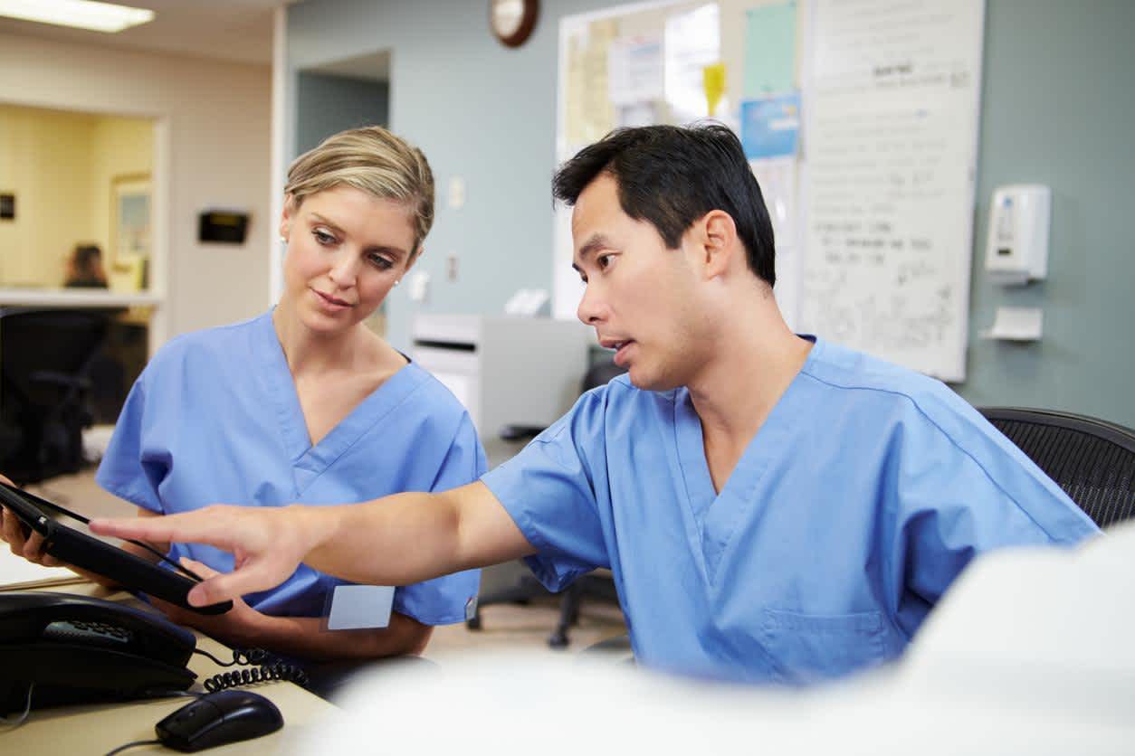 Charge nurses working together in the hospital