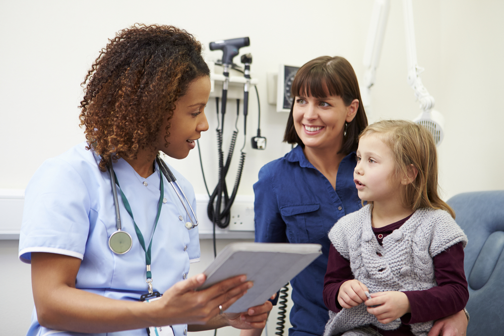 Family nurse practitioner talking to child and mother