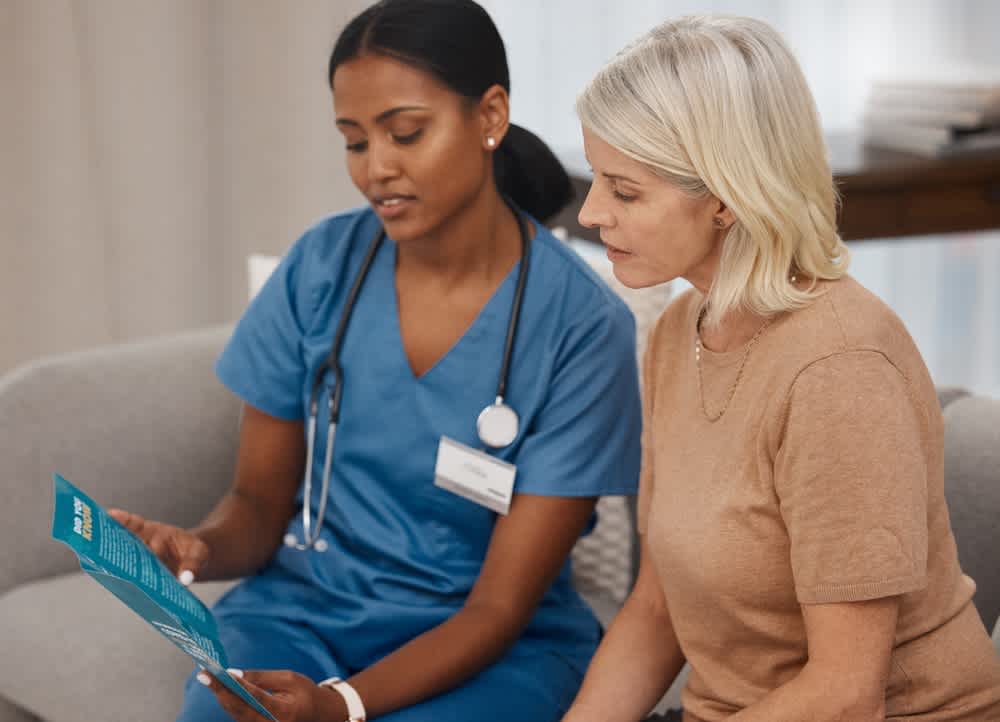 BSN registered nurse talking to a patient