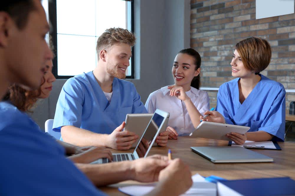 Nurses studying together for nursing school