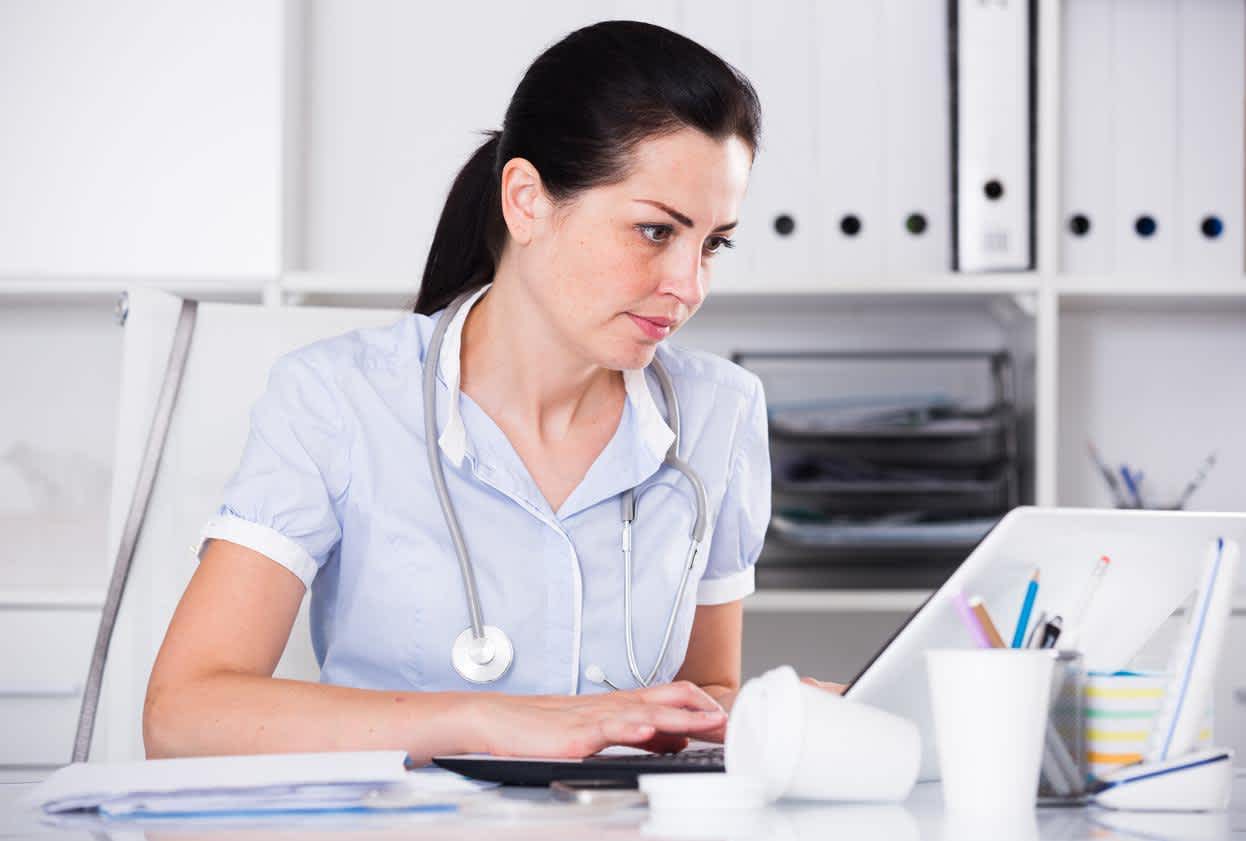 Nurse Administrator working on a laptop on the hospital