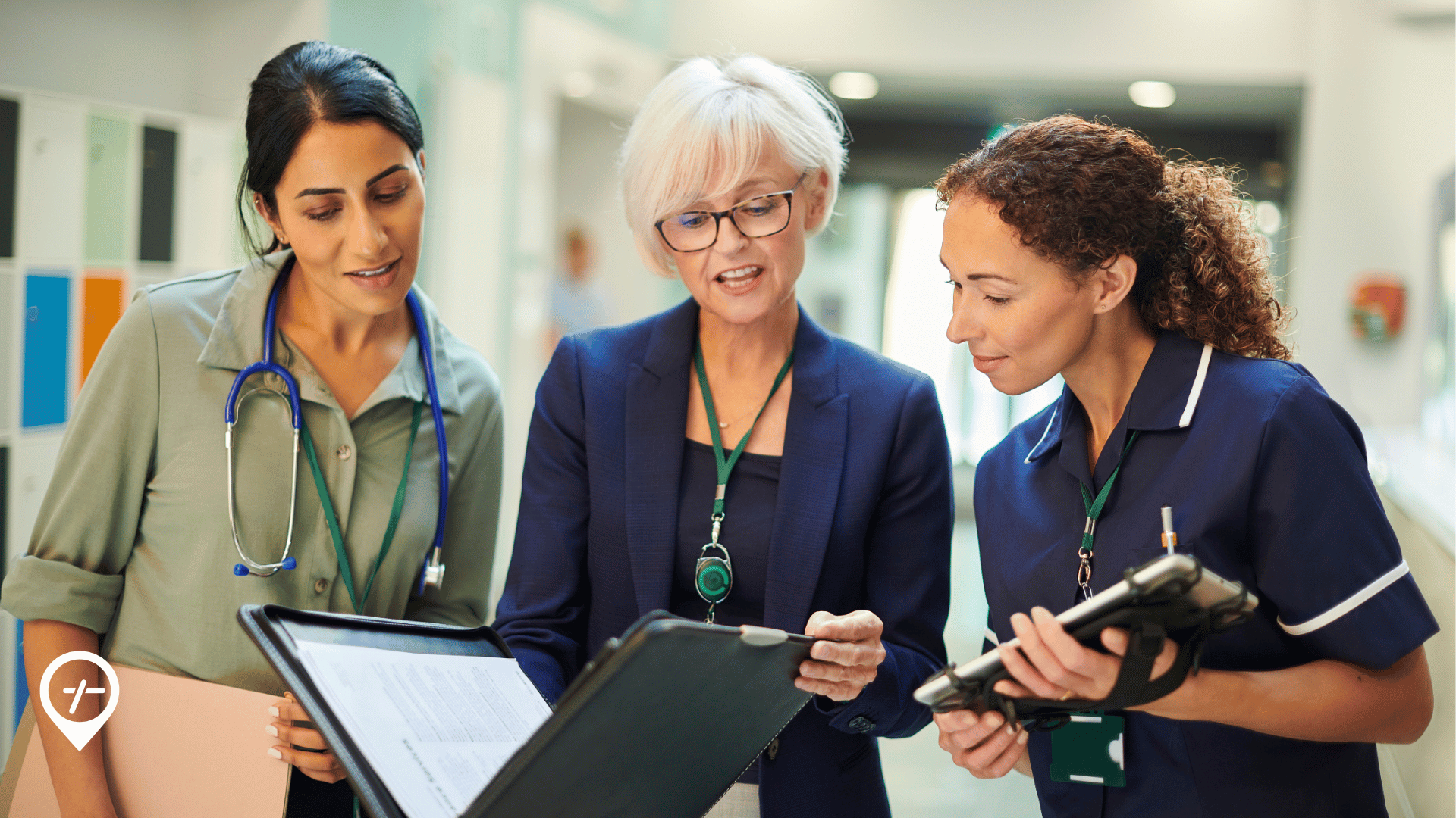 A CNO, COO, and nurse leader review workforce availability data in relation to hospital capacity management.   