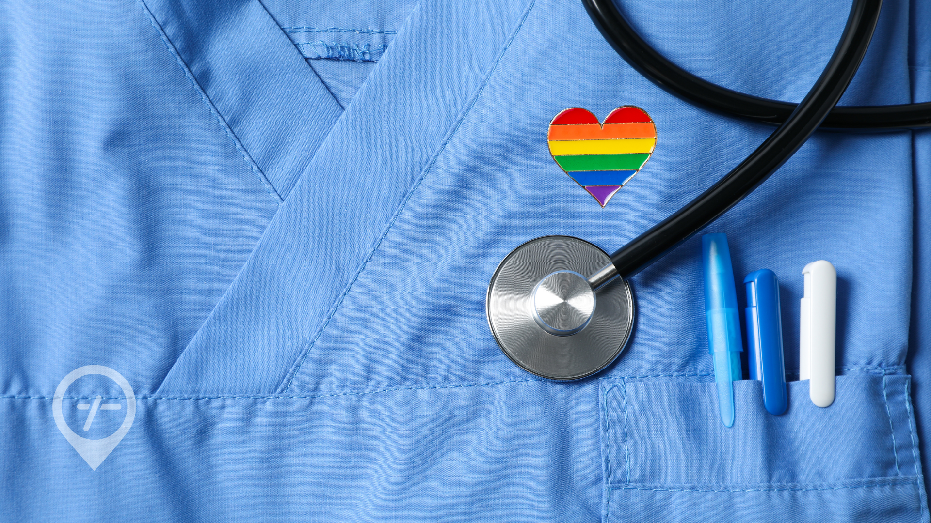 Nurses have been caring with pride for decades. Let's honor the exceptional healthcare professionals who have and continue to advocate for LGBTQ+ patients. (Nurse wearing rainbow heart pin on scrubs.)