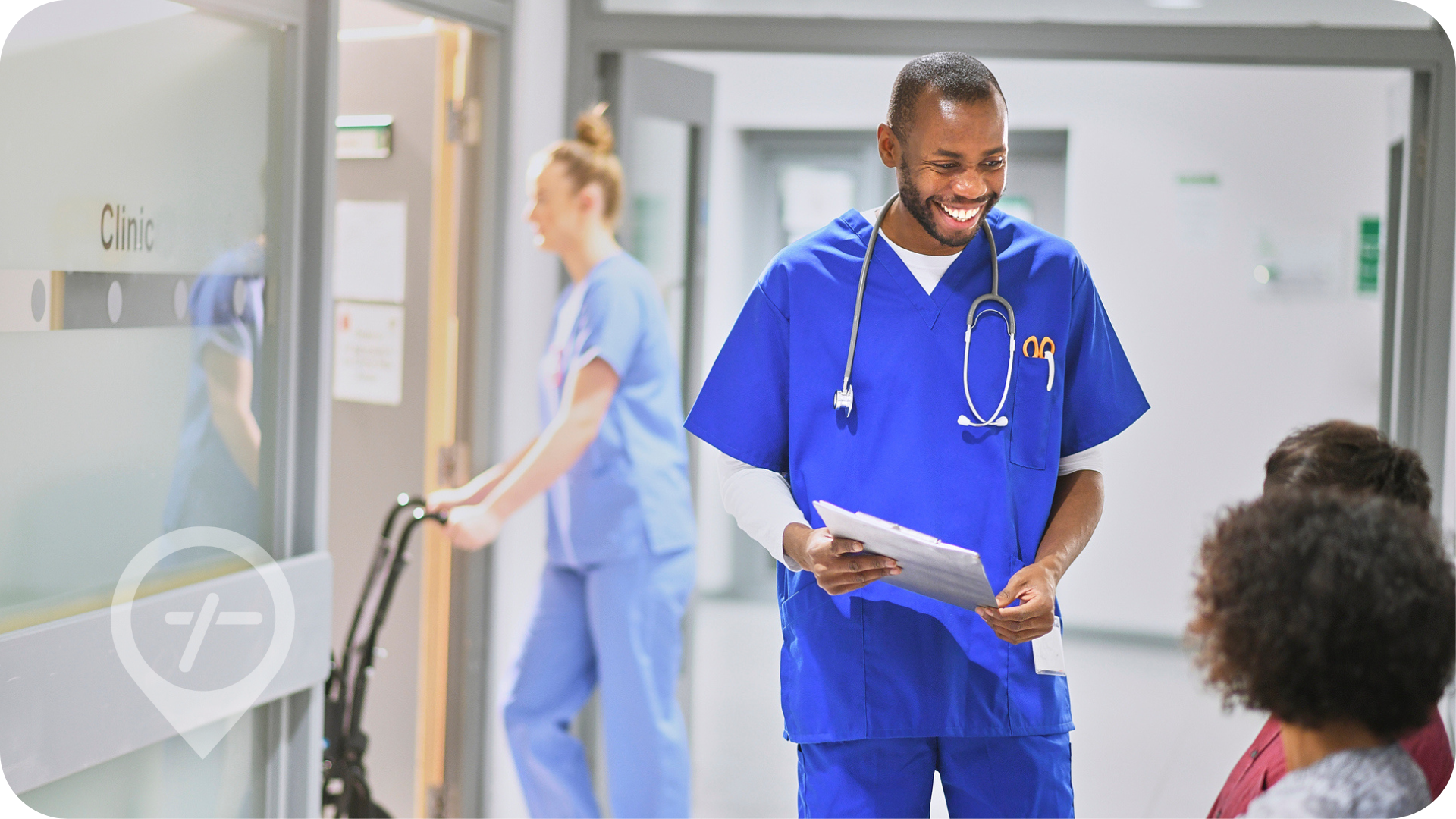 African American male nurse meets with patient