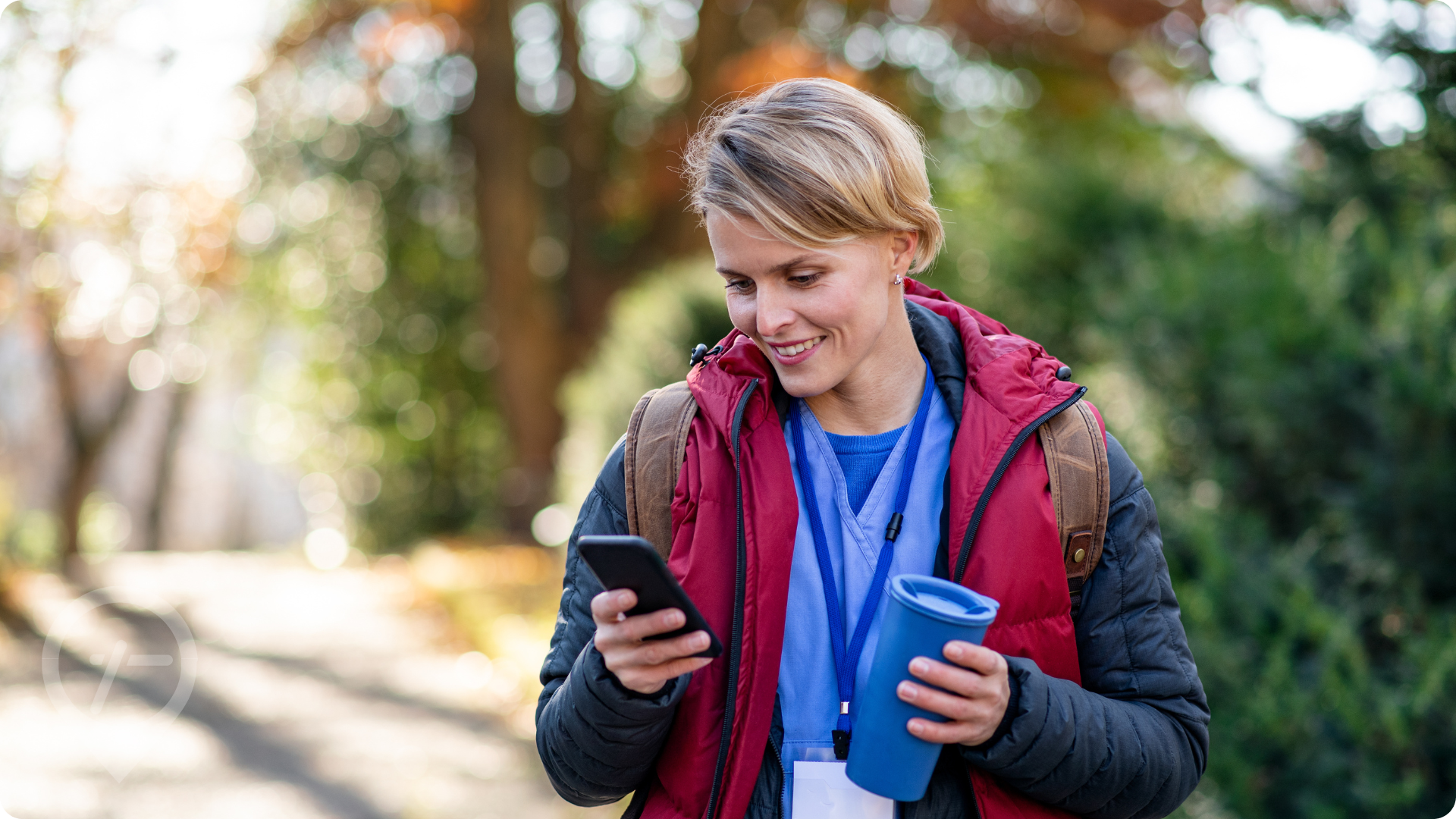 Nurse outside looking at phone