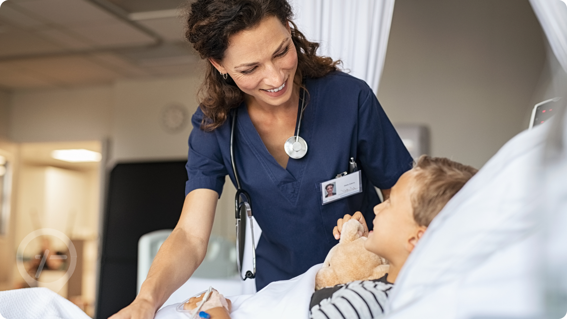 Nurse smiling at young patient in hospital