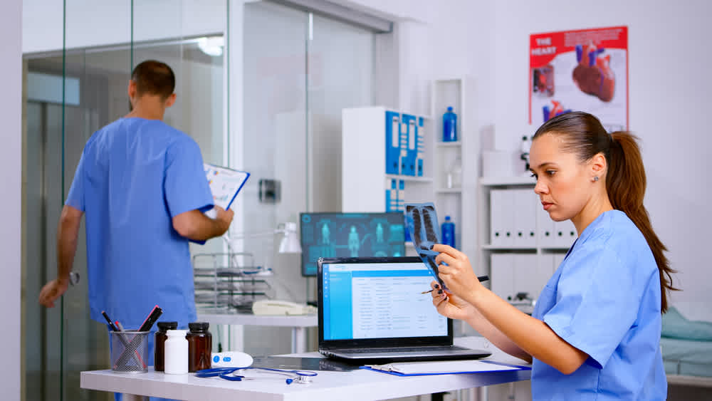 Nurse case manager sitting at a desk