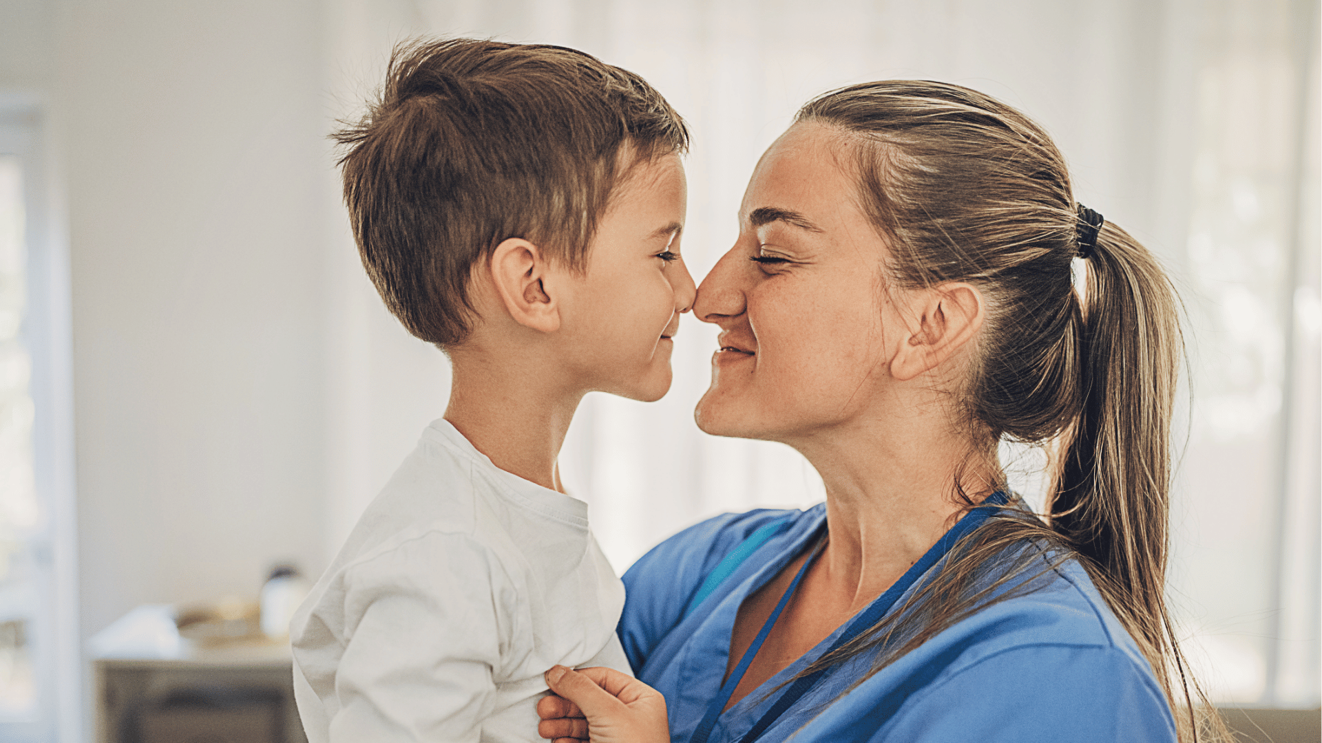 A nurse embraces her young son after work, highlighting the importance of work-life balance and flexible nursing schedules.