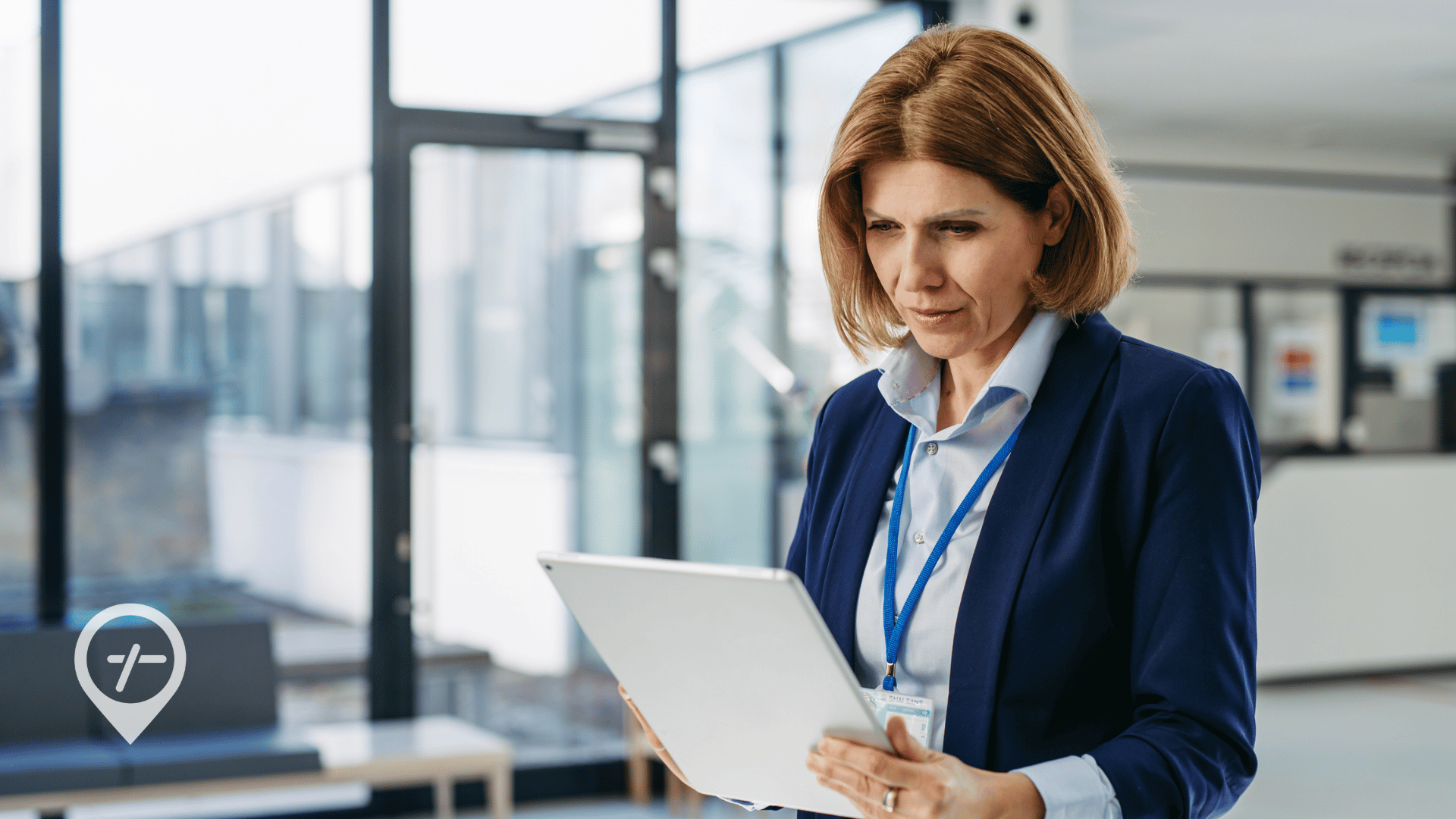 A hospital nursing executive looks down at her tablet.