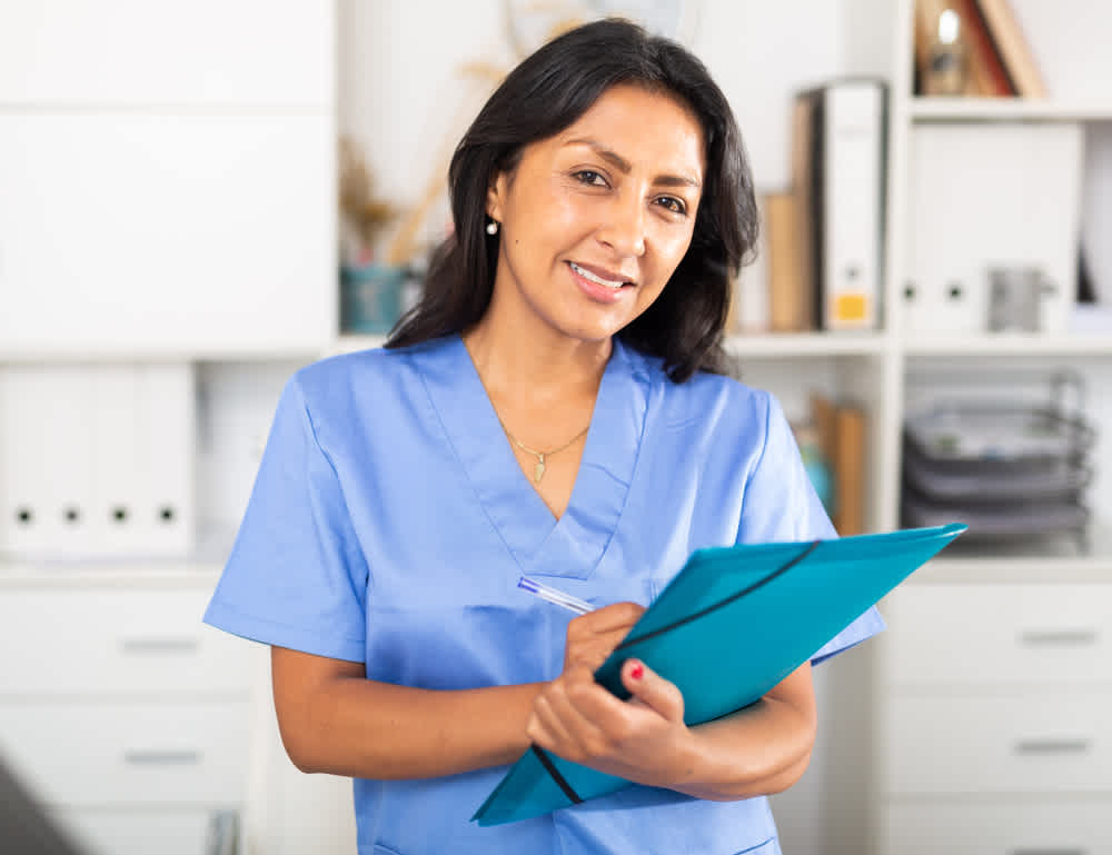 Nurse clinician holding a medical folder