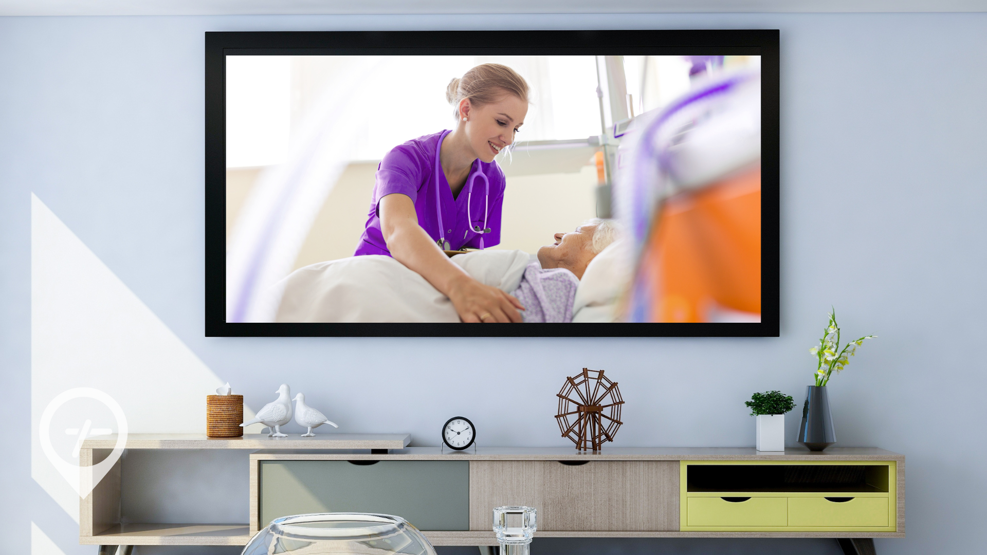 An entertainment center in a living room with a nurse tucking in a patient on the TV screen. 