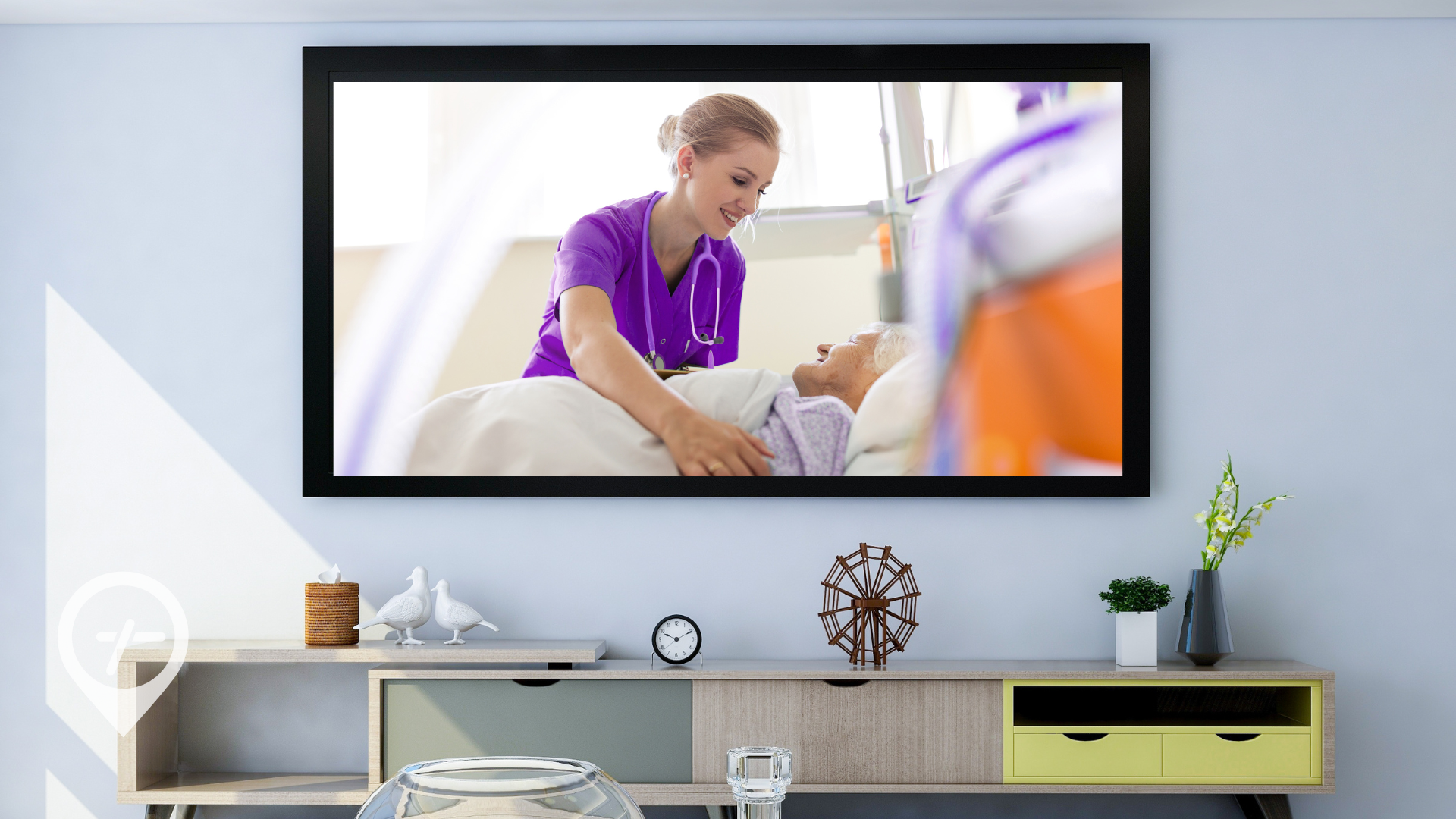 An entertainment center in a living room with a nurse tucking in a patient on the TV screen.