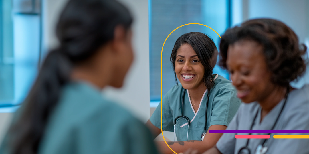 Two nurses at desks.