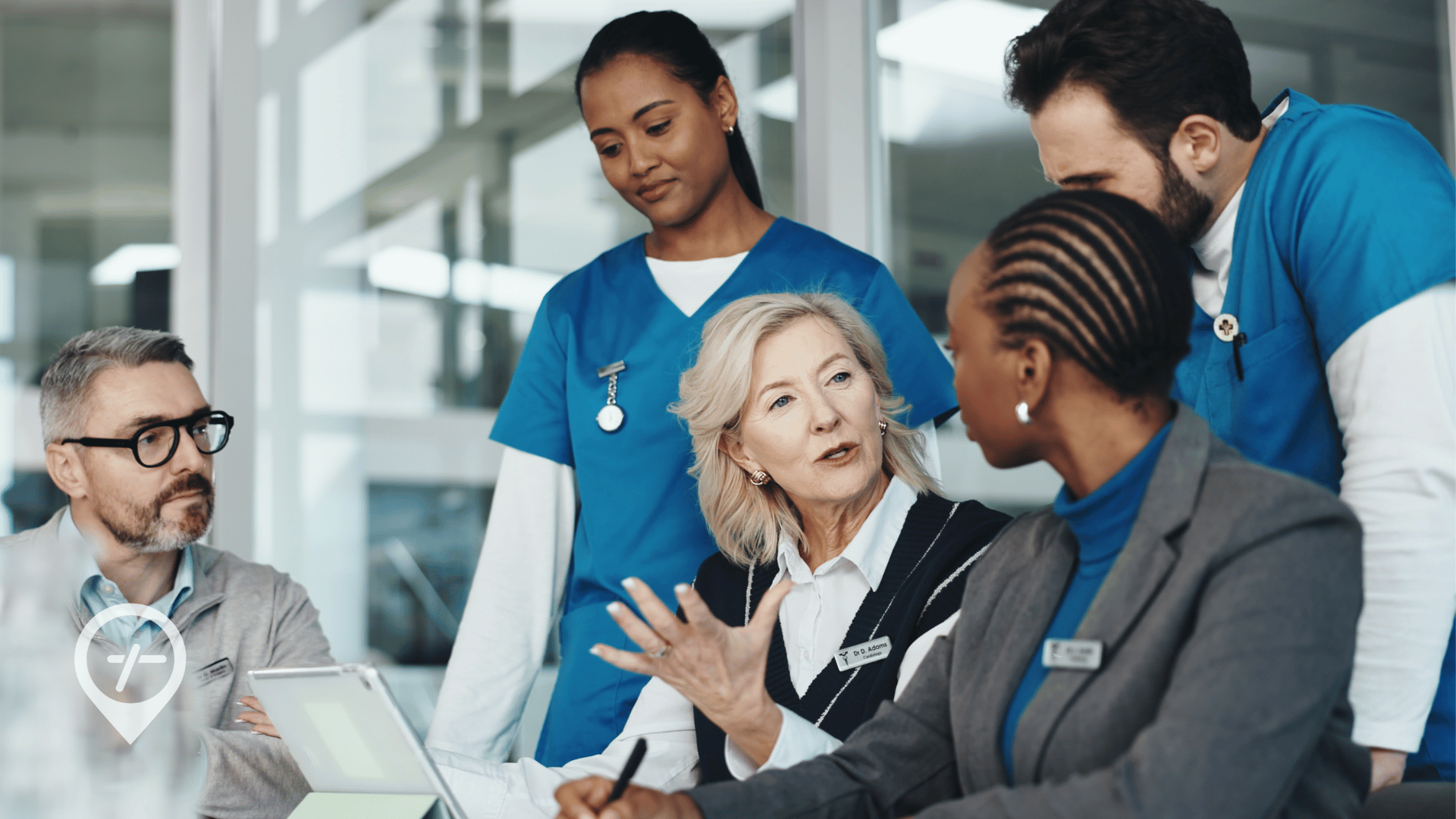 A Chief Nursing Officer meeting with her team to address workforce planning challenges in healthcare and nurse staffing strategy.