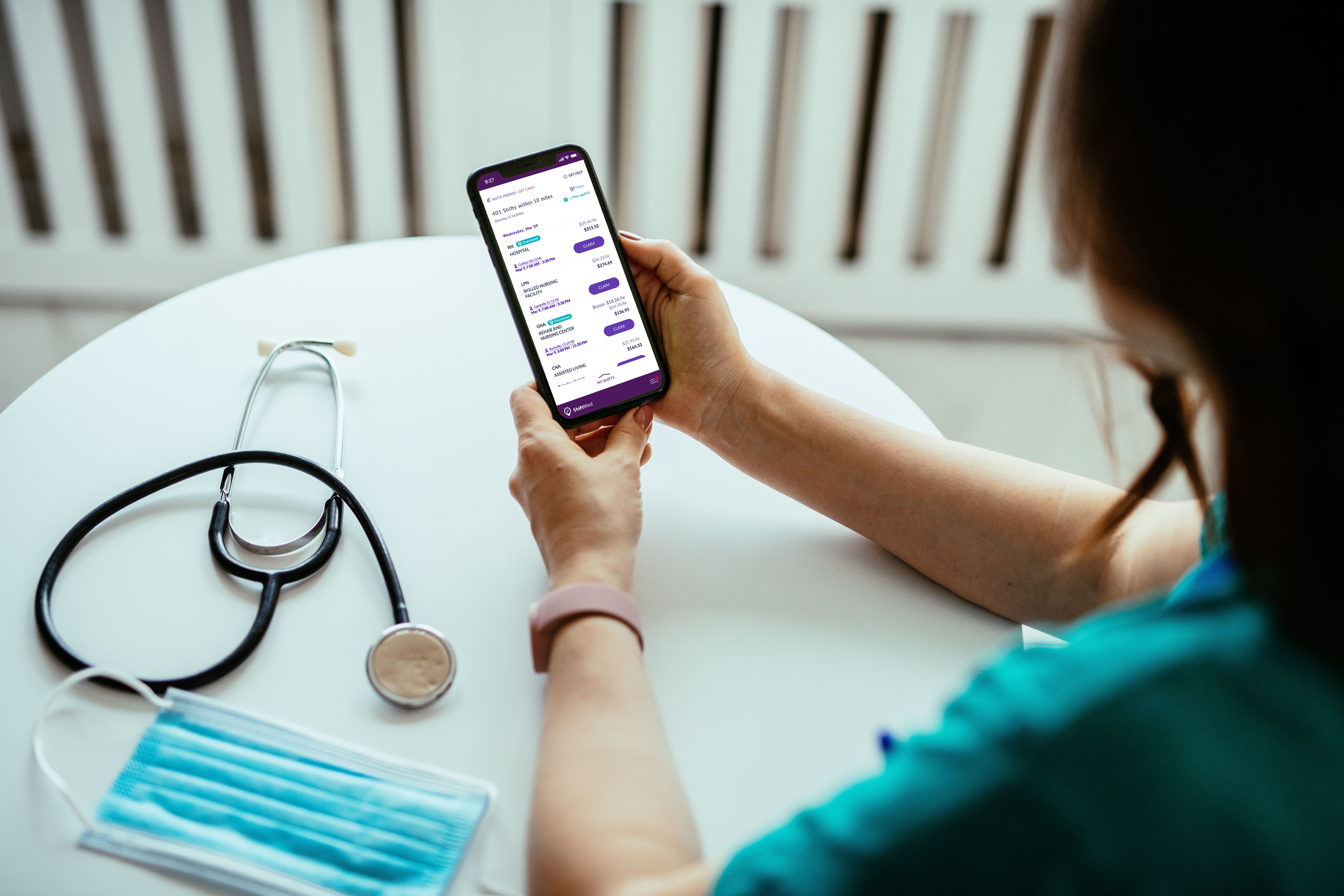 A nurse scrolls through the ShiftMed nursing jobs app to build a flexible work schedule. 