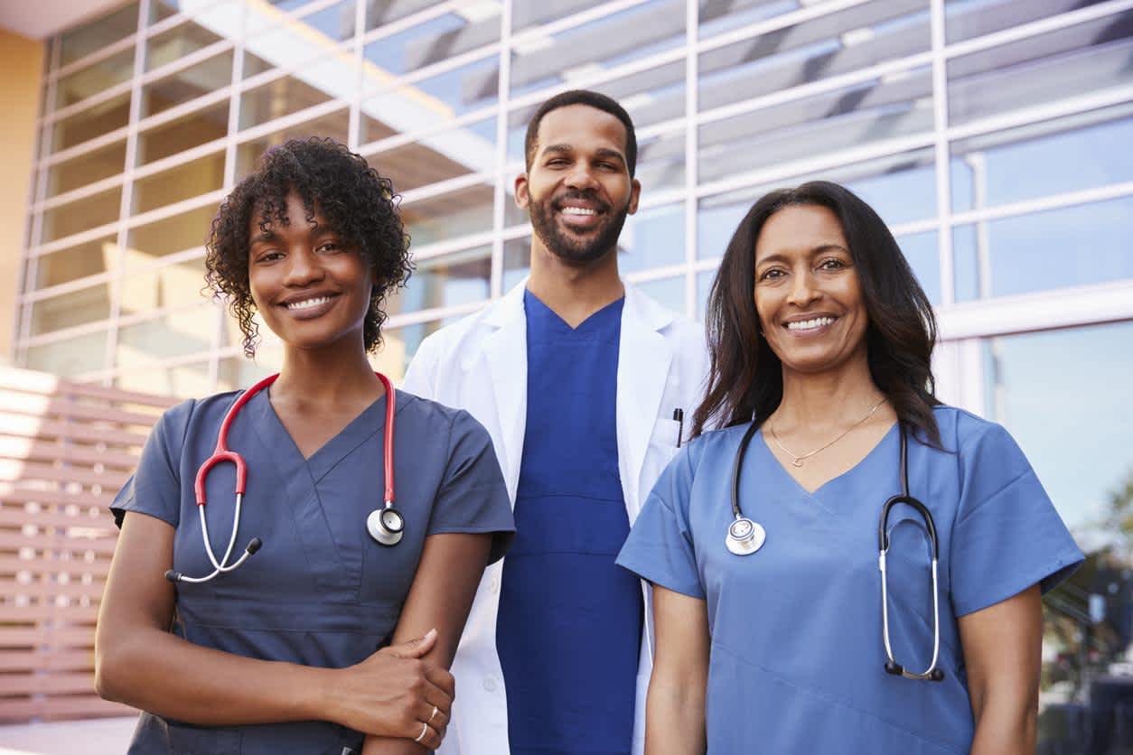 Nurses and a Doctor in front of the hospital