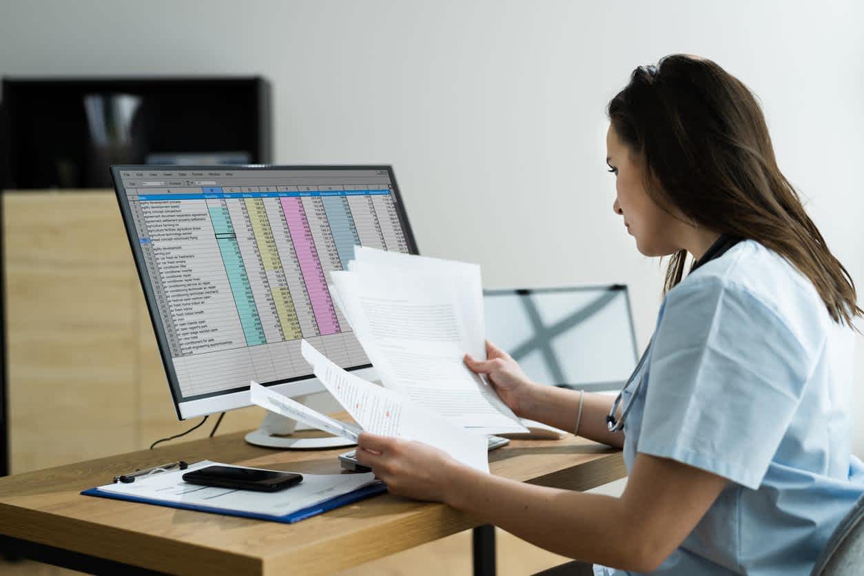 Charge Nurse working at the computer in the hospital