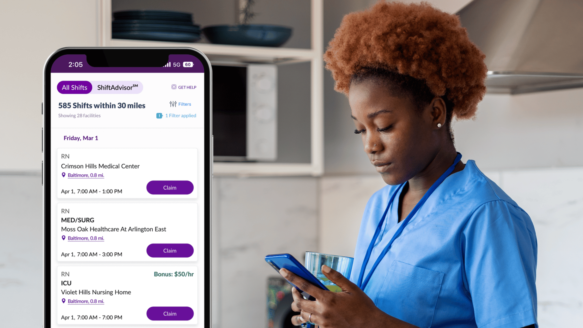 Nurse in her kitchen using the ShiftMed app to browse flexible nursing jobs and manage her work schedule from home.