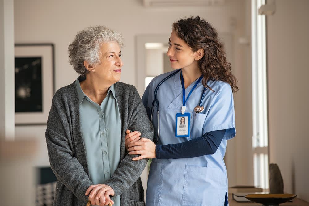 HHA nurse assisting elderly patient
