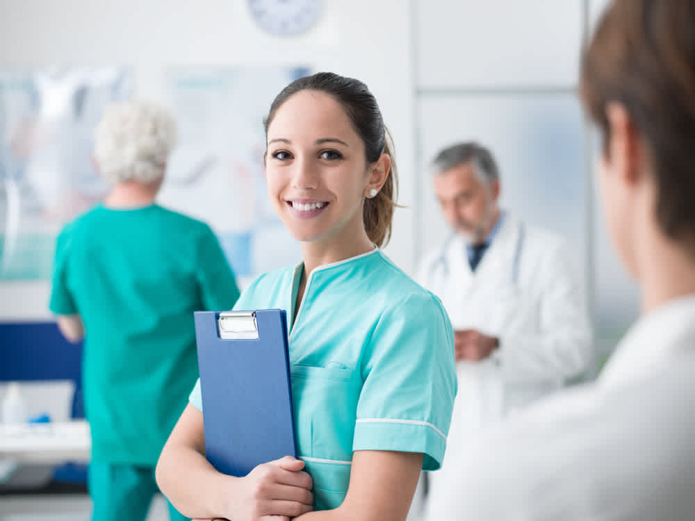 Medical assistant holding a clipboard