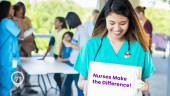 An image of a nurse holding up a clipboard that says Nurses "Make the Difference" to celebrate National Nurses Week.