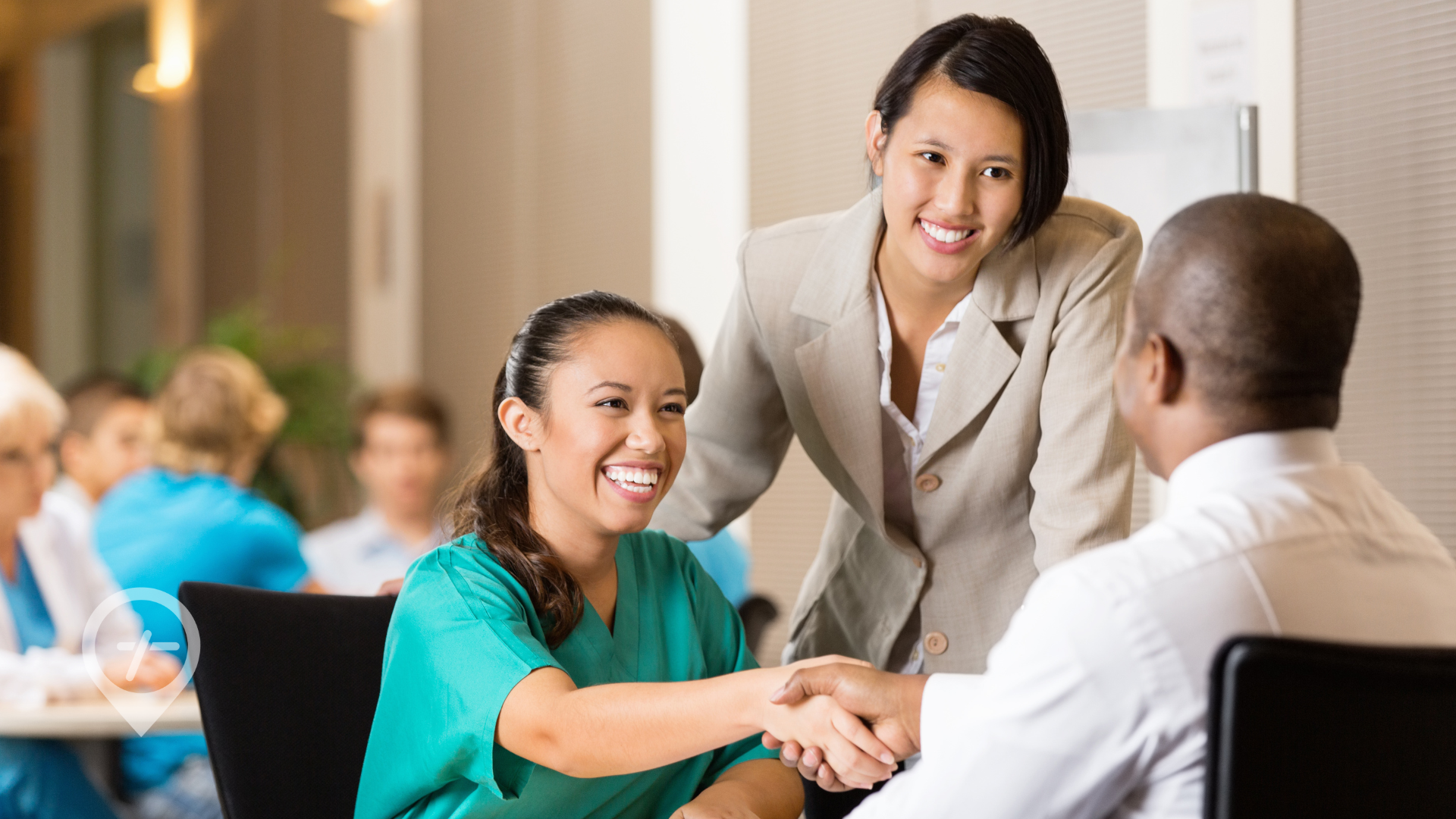 Nurse shaking hands with a hiring manager at a hospital.