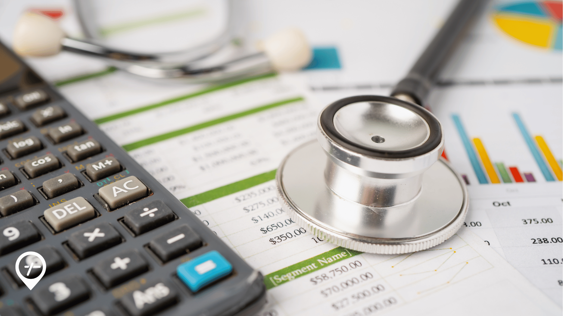 Stethoscope and calculator on a desk representing hospital staffing costs and healthcare financial analysis.