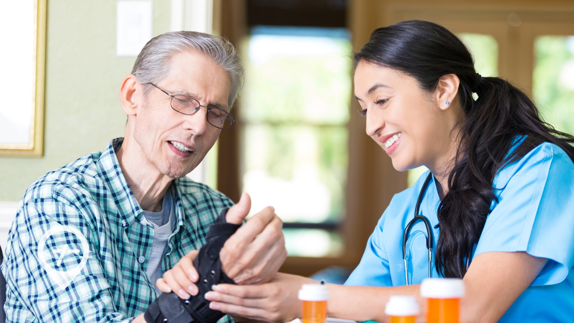 A nurse helps position a brace on a patient's wrist.
