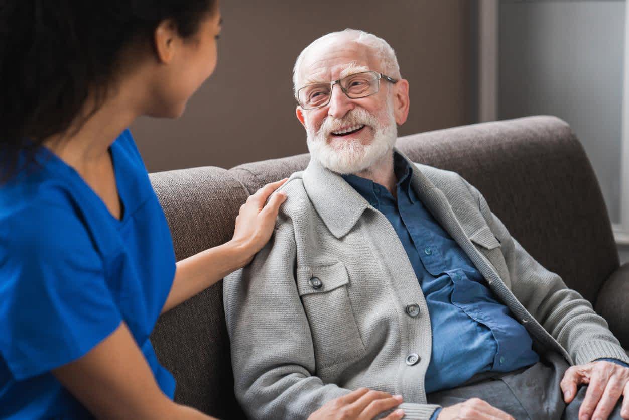 Hospice nurses with elderly patient